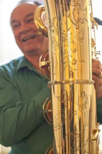 Tim Price talks about the etchings on some of the instruments in his saxophone collection. Price's niece is an artist who drew pictures of people playing Price's saxophones and he had the instrument maker etch the drawings onto the saxophones.