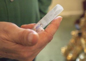 Tim Price shows one of the plastic reeds used for the bigger saxophones. Dean Hare/Daily News